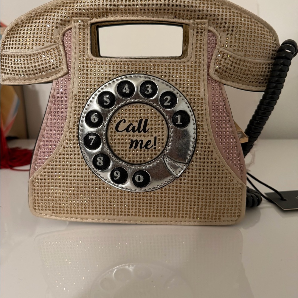 Aldo novelty telephone-shaped purse with a rotary dial design